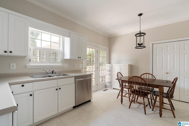 kitchen with decorative light fixtures, stainless steel dishwasher, and white cabinets