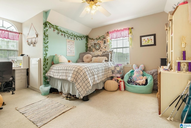 carpeted bedroom featuring lofted ceiling and ceiling fan