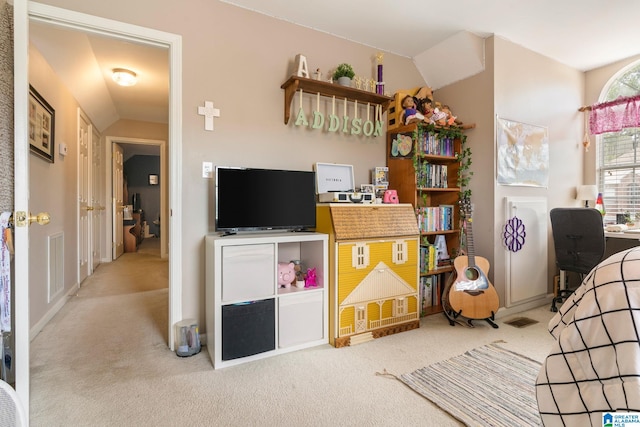 carpeted bedroom with vaulted ceiling