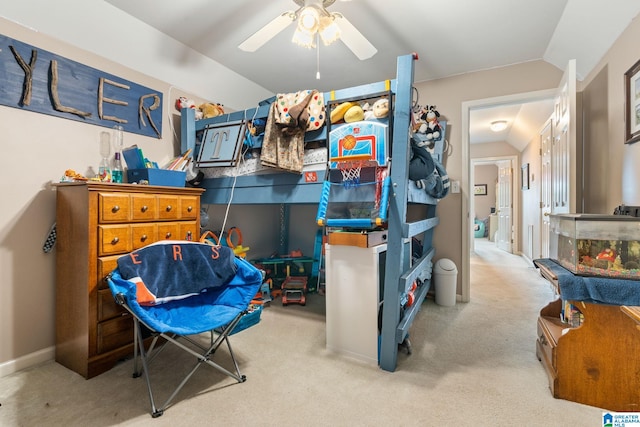 interior space featuring lofted ceiling, light colored carpet, and ceiling fan