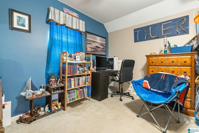 carpeted office with vaulted ceiling