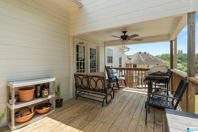 wooden terrace featuring ceiling fan