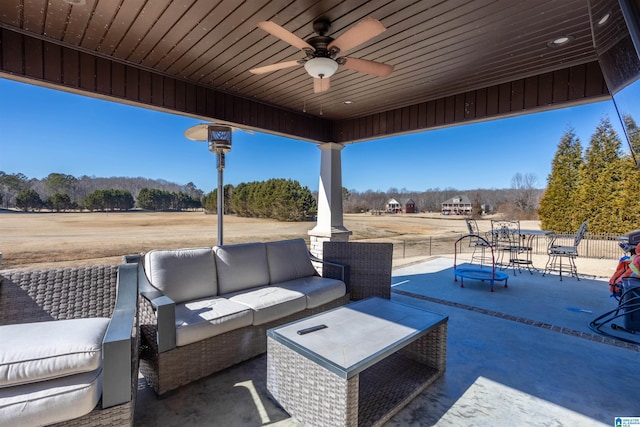 view of patio with ceiling fan and an outdoor hangout area