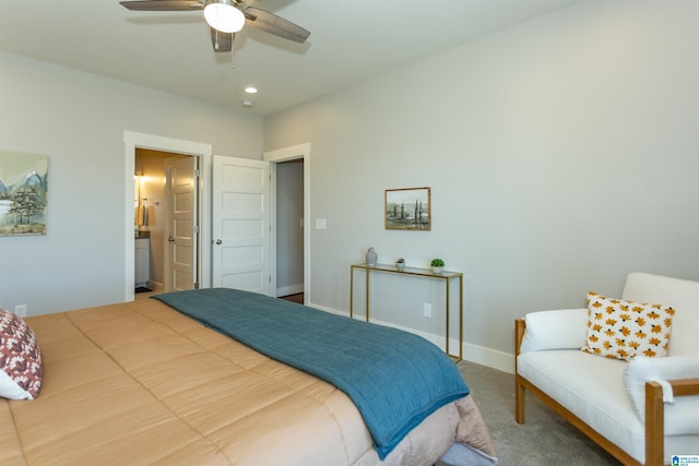 carpeted bedroom with ceiling fan and ensuite bathroom