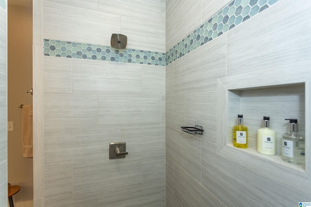 bathroom with tiled shower