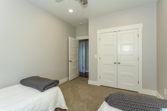 carpeted bedroom with a closet, baseboards, a ceiling fan, and recessed lighting