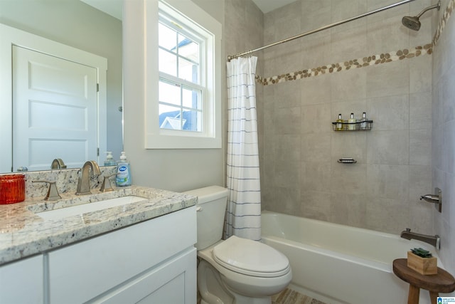 full bathroom with vanity, toilet, and shower / bath combo