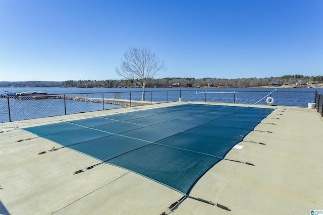 view of pool featuring a water view