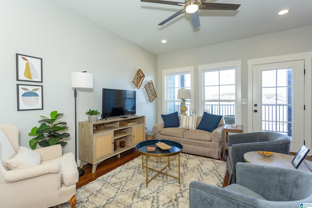 living room with ceiling fan and hardwood / wood-style floors