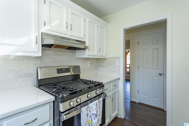 kitchen featuring stainless steel range with gas cooktop, white cabinets, dark hardwood / wood-style flooring, and decorative backsplash