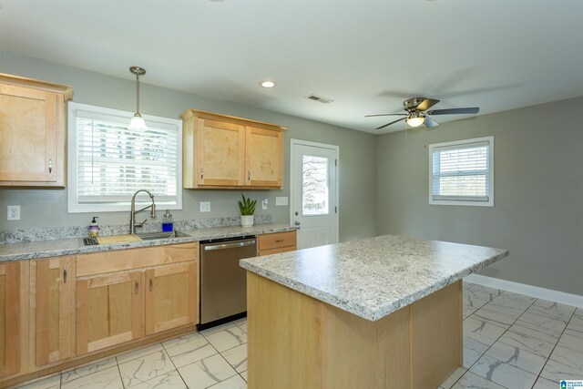 kitchen with a center island, stainless steel dishwasher, sink, pendant lighting, and ceiling fan