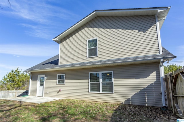 rear view of property featuring a patio