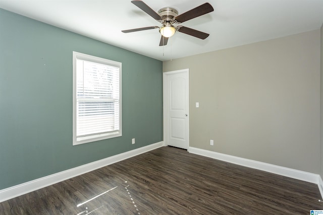 unfurnished room featuring ceiling fan and dark hardwood / wood-style flooring