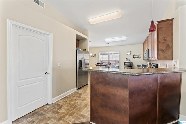 kitchen featuring appliances with stainless steel finishes and kitchen peninsula