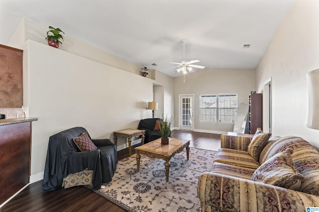 living room with lofted ceiling, hardwood / wood-style floors, and ceiling fan