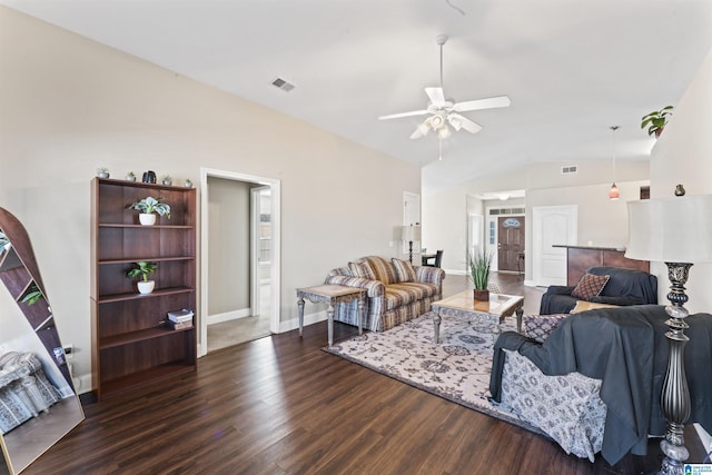 living room featuring dark hardwood / wood-style flooring, lofted ceiling, and ceiling fan