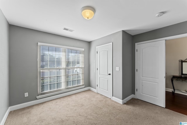 bedroom with light carpet