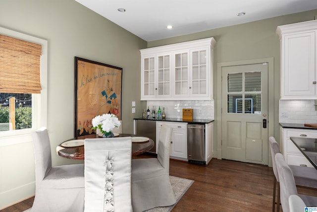 dining space featuring dark wood-type flooring