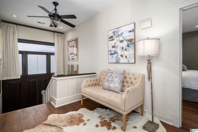 sitting room featuring hardwood / wood-style flooring and ceiling fan