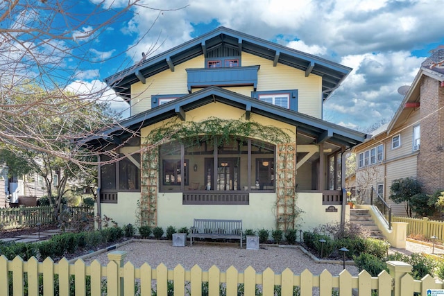 view of front of property with a sunroom