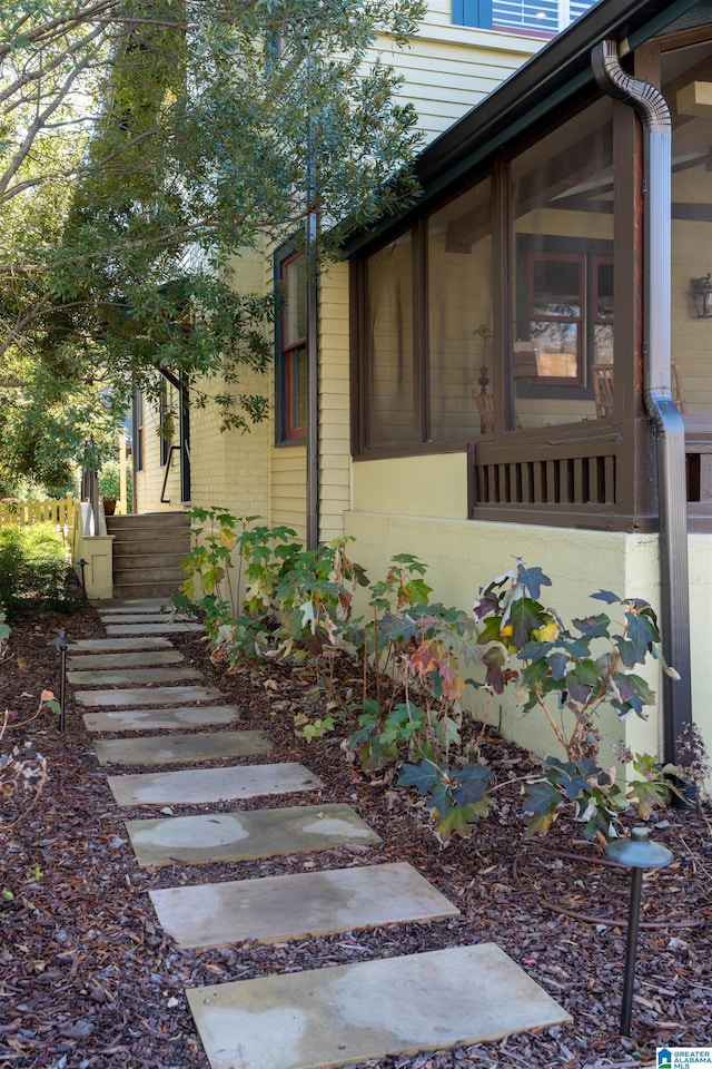 view of home's exterior featuring a sunroom