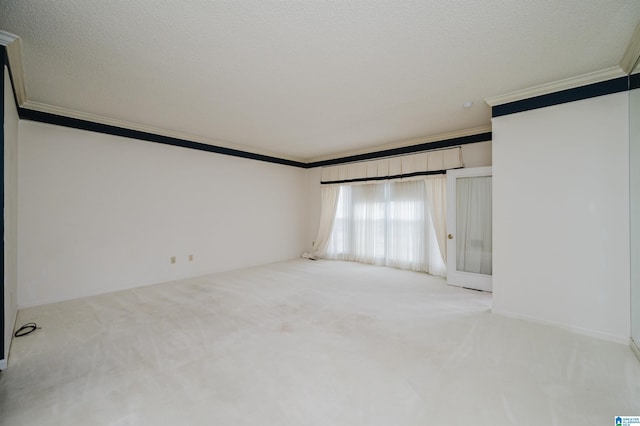 empty room with light carpet, crown molding, and a textured ceiling