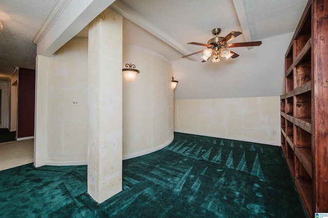 additional living space with dark colored carpet, lofted ceiling, ceiling fan, and a textured ceiling