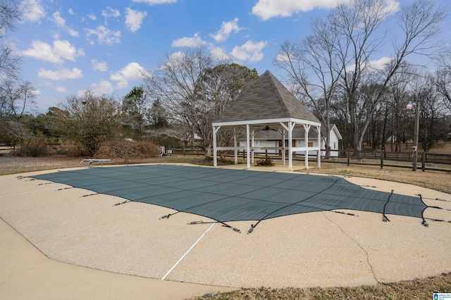 view of pool with a gazebo, a patio area, and a diving board