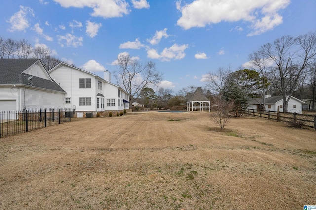 view of yard featuring a gazebo and central air condition unit