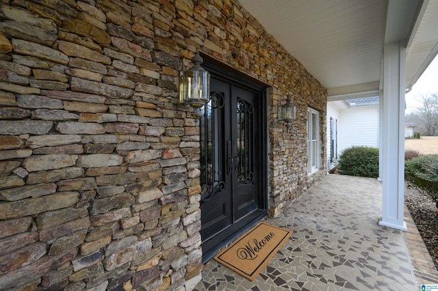 property entrance featuring covered porch