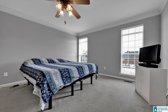 carpeted bedroom with crown molding and ceiling fan