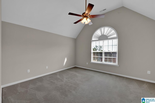 spare room with ceiling fan, carpet flooring, and vaulted ceiling