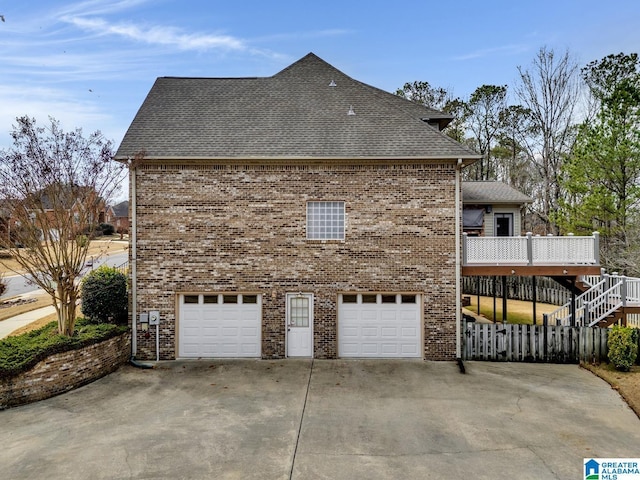 view of side of home featuring a garage