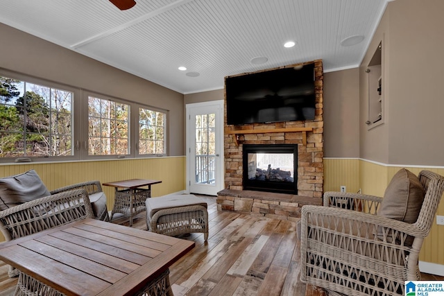 interior space with crown molding, a fireplace, and hardwood / wood-style floors