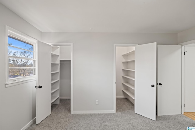 interior space featuring light colored carpet