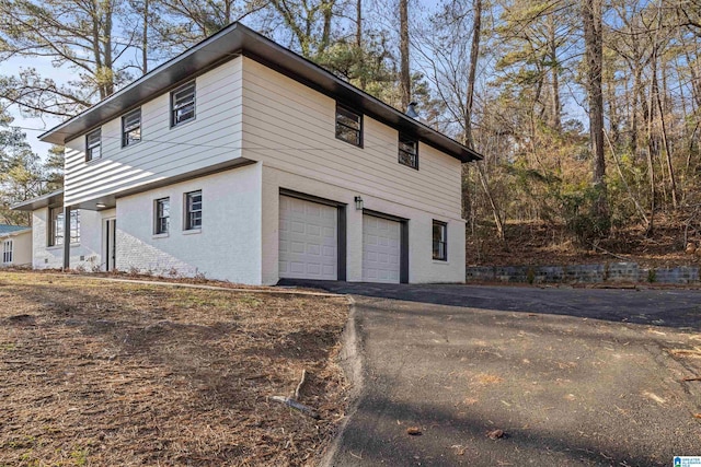 view of property exterior with a garage