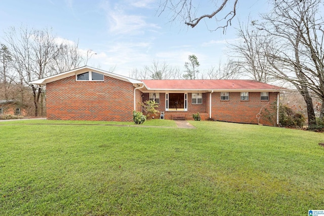 ranch-style house featuring a front lawn