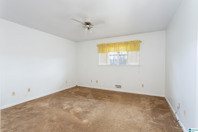 spare room with carpet flooring and ceiling fan