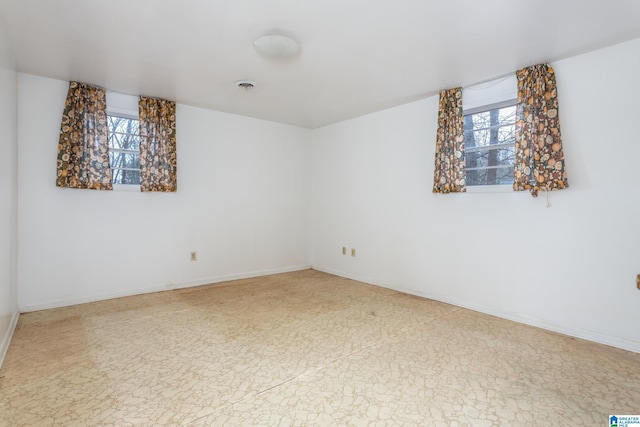 spare room with plenty of natural light