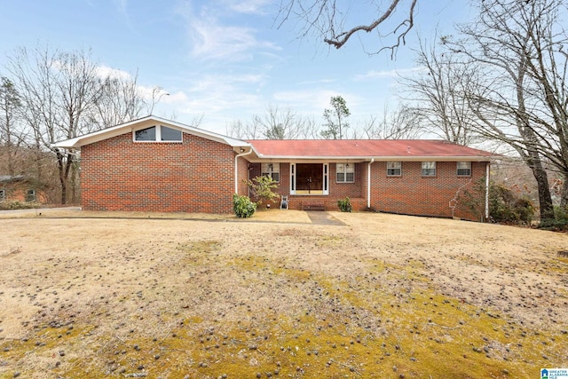 single story home featuring a front yard and covered porch