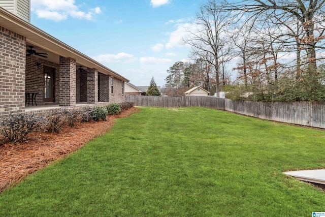 view of yard with ceiling fan