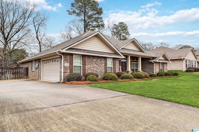 view of front facade featuring a garage and a front lawn