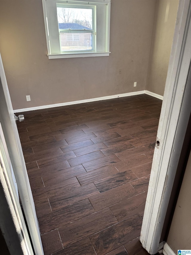 unfurnished room featuring dark hardwood / wood-style floors