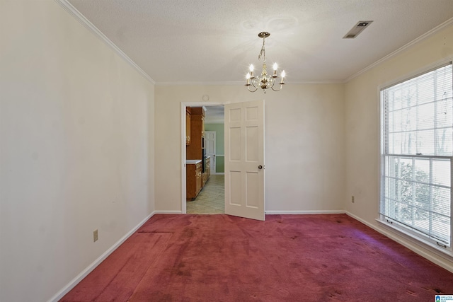 unfurnished room with a wealth of natural light, ornamental molding, light colored carpet, and a chandelier