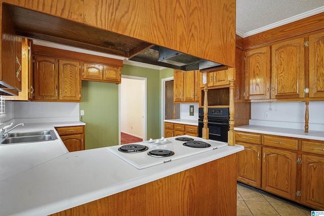 kitchen featuring sink, light tile patterned floors, ornamental molding, oven, and white electric stovetop