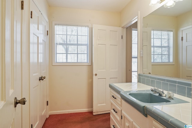 bathroom with vanity and decorative backsplash