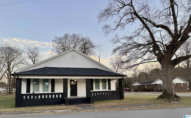 bungalow-style house featuring a yard