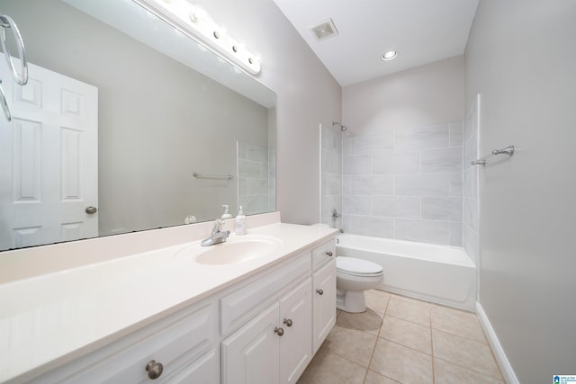 full bathroom with tiled shower / bath, tile patterned floors, toilet, and vanity