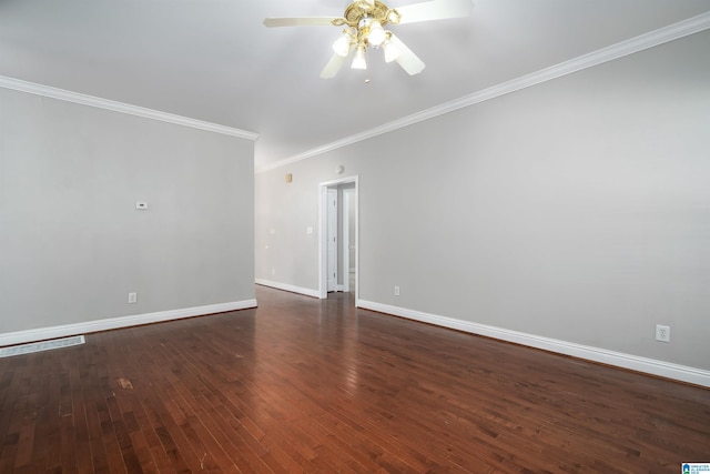 spare room featuring crown molding, dark hardwood / wood-style floors, and ceiling fan