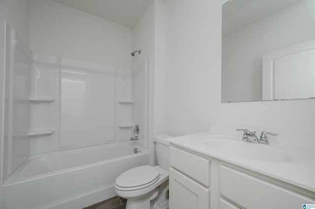 full bathroom with vanity, wood-type flooring, bathing tub / shower combination, and toilet